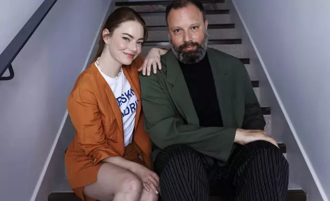 Emma Stone, left, and director Yorgos Lanthimos pose for a portrait photograph for the film 'Kinds of Kindness' at the 77th international film festival, Cannes, southern France, Saturday, May 18 2024. (Photo by Vianney Le Caer/Invision/AP)