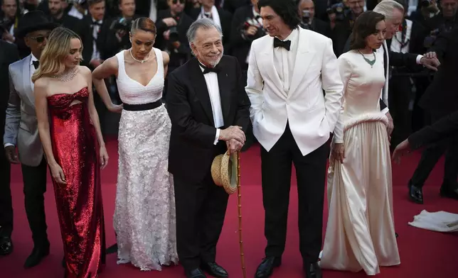 Giancarlo Esposito, from left, Chloe Fineman, Nathalie Emmanuel, director Francis Ford Coppola, Adam Driver, Aubrey Plaza and Jon Voight pose for photographers upon arrival at the premiere of the film 'Megalopolis' at the 77th international film festival, Cannes, southern France, Thursday, May 16, 2024. (Photo by Daniel Cole/Invision/AP)