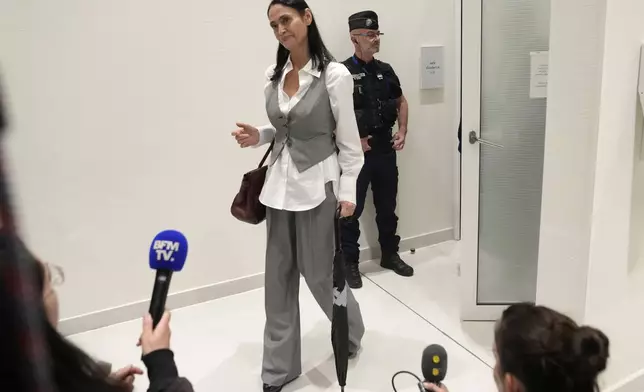 British actor Charlotte Lewis leaves the courtroom after the verdict against filmmaker Roman Polanski Tuesday, May 14, 2024 in Paris. Roman Polanski was acquitted of defaming the actor whom he described as a liar after she accused the director of sexual assault. (AP Photo/Thibault Camus)