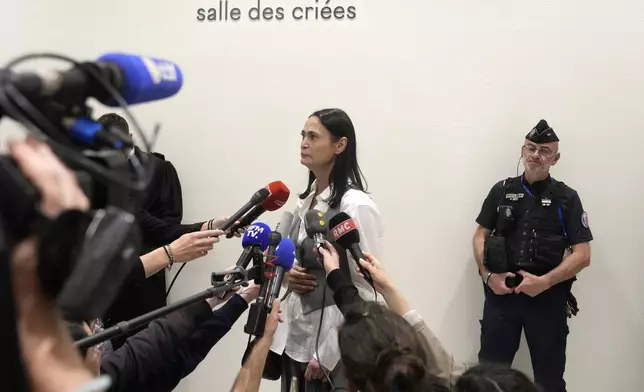 British actor Charlotte Lewis leaves the courtroom after the verdict against filmmaker Roman Polanski Tuesday, May 14, 2024 in Paris. Roman Polanski was acquitted of defaming the actor whom he described as a liar after she accused the director of sexual assault. (AP Photo/Thibault Camus)