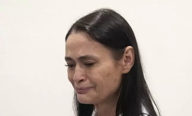 British actor Charlotte Lewis reacts after the verdict against filmmaker Roman Polanski Tuesday, May 14, 2024 in Paris. Roman Polanski was acquitted of defaming the actor whom he described as a liar after she accused the director of sexual assault. (AP Photo/Thibault Camus)