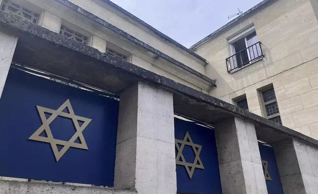 The synagogue in Rouen is pictured after a man armed with a knife and a metal bar is suspected of having set fire, Friday, May 17, 2024. French police have shot and killed a man armed with a knife and a metal bar who is suspected of having set fire to a synagogue in the Normandy city of Rouen. French police said officers were alerted early Friday morning that smoke was rising from the synagogue and came face to face with the man when they got there. (AP Photo/Oleg Cetinic)