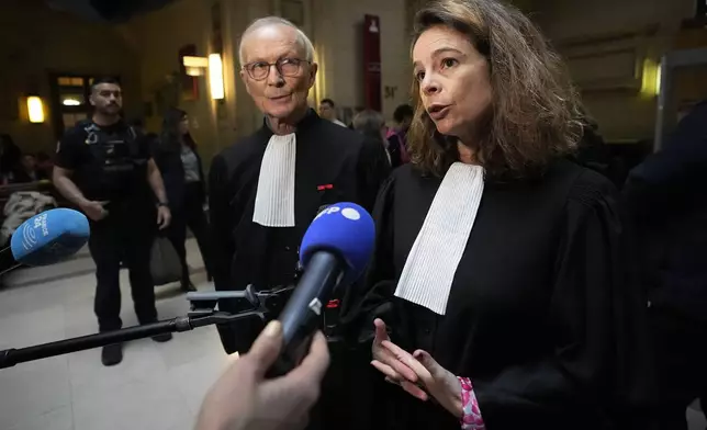 Lawyer Clemence Bectarte answers reporters Tuesday, May 21, 2024 at a courtroom in Paris. A Paris court will this week seek to determine whether Syrian intelligence officials — the most senior to go on trial in a European court over crimes allegedly committed during the country's civil war — were responsible for the 2013 disappearance and deaths of Patrick Dabbagh and his father Mazen. The four-day hearings, starting Tuesday, are expected to air chilling allegations that President Bashar Assad's government has widely used torture and arbitrary detentions to hold on to power during the conflict, now in its 14th year. (AP Photo/Michel Euler)