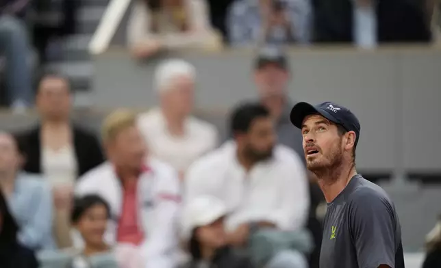 Britain's Andy Murray looks on the screen during his first round match against Switzerland's Stan Wawrinka of the French Open tennis tournament at the Roland Garros stadium in Paris, Sunday, May 26, 2024. (AP Photo/Thibault Camus)