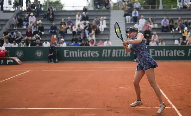 Amanda Anisimova of the U.S. plays a shot against Slovakia's Rebecca Sramkova during their first round match of the French Open tennis tournament at the Roland Garros stadium in Paris, Sunday, May 26, 2024. (AP Photo/Thibault Camus)