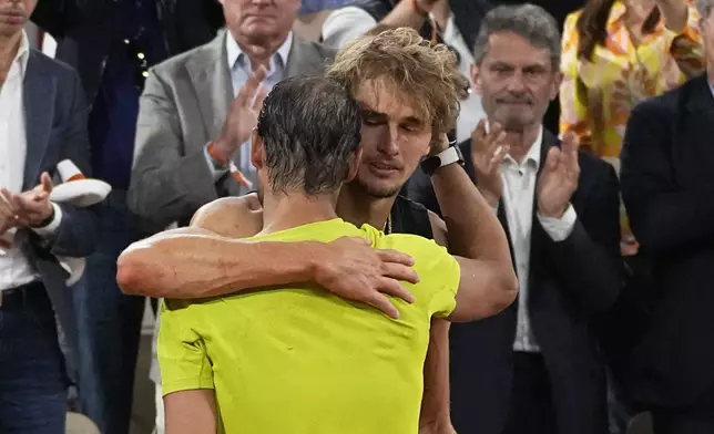 FILE - Germany's Alexander Zverev hugs Spain's Rafael Nadal, after their semifinal match of the French Open tennis tournament at the Roland Garros stadium Friday, June 3, 2022 in Paris. Alexander Zverev stopped playing because of an injury. Rafael Nadal is in the French Open field, after all, and the 14-time champion was set up for a challenging first-round matchup in Thursday’s, May 23, 2024, draw against Alexander Zverev. (AP Photo/Michel Euler, File)