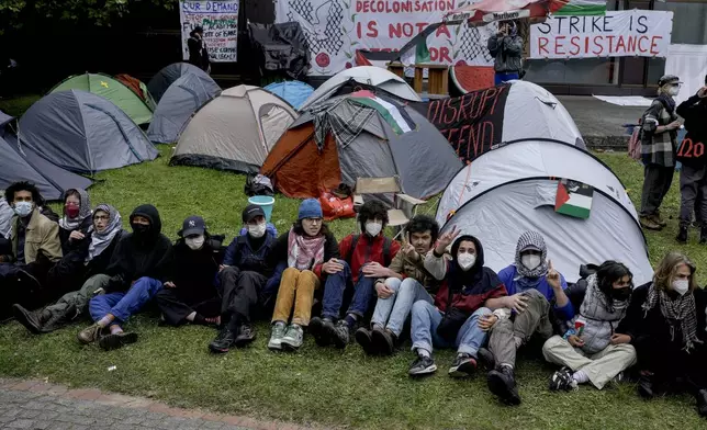 Participants have set up tents during a pro-Palestinians demonstration by the group "Student Coalition Berlin" in the theater courtyard of the 'Freie Universität Berlin' university in Berlin, Germany, Tuesday, May 7, 2024. Pro-Palestinian activists occupied a courtyard of the Free University in Berlin on Tuesday. (AP Photo/Markus Schreiber)