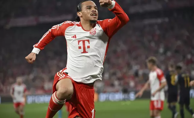 Munich's Leroy Sane, celebrates after scoring his side's first goal during the Champions League, semifinal first leg, soccer match between FC Bayern Munich and Real Madrid in Munich, Germany, Tuesday, April 30, 2024. (Sven Hoppe/dpa via AP)