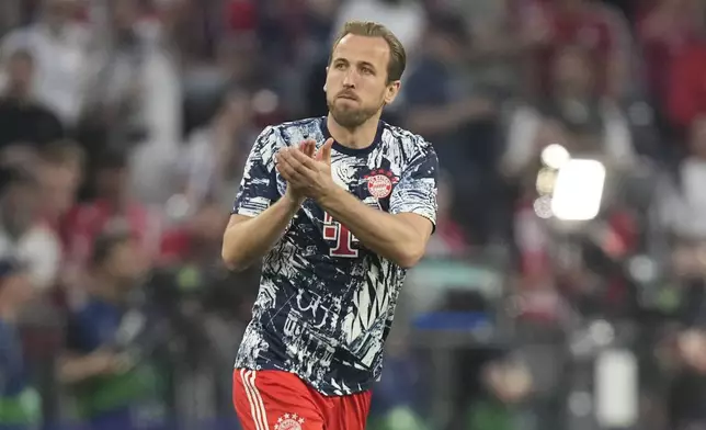 Bayern's Harry Kane applauds fans as he warms up prior to the Champions League semifinal first leg soccer match between Bayern Munich and Real Madrid at the Allianz Arena in Munich, Germany, Tuesday, April 30, 2024. (AP Photo/Matthias Schrader)