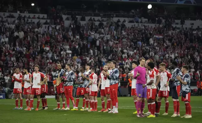 Bayern Munich players applaud fans at the end of the Champions League semifinal first leg soccer match between Bayern Munich and Real Madrid at the Allianz Arena in Munich, Germany, Tuesday, April 30, 2024. (AP Photo/Matthias Schrader)