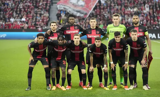Leverkusen team poses prior to the start of the Europa League second leg semi-final soccer match between Leverkusen and Roma at the BayArena in Leverkusen, Germany, Thursday, May 9, 2024. (AP Photo/Matthias Schrader)