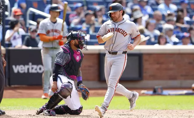 San Francisco Giants' Brett Wisely scores a run against the New York Mets during the sixth inning of a baseball game, Saturday, May 25, 2024, in New York. (AP Photo/Noah K. Murray)
