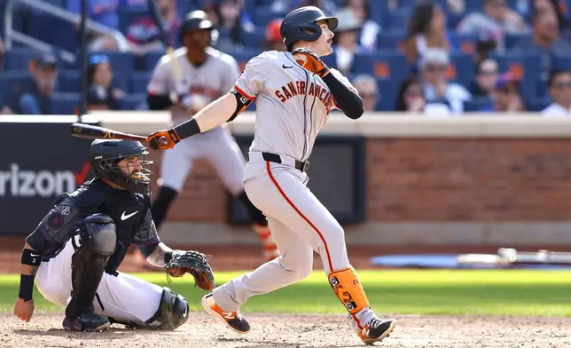 San Francisco Giants' Mike Yastrzemski hits an RBI triple during the tenth inning of a baseball game against the New York Mets, Saturday, May 25, 2024, in New York. The San Francisco Giants won 7-2. (AP Photo/Noah K. Murray)