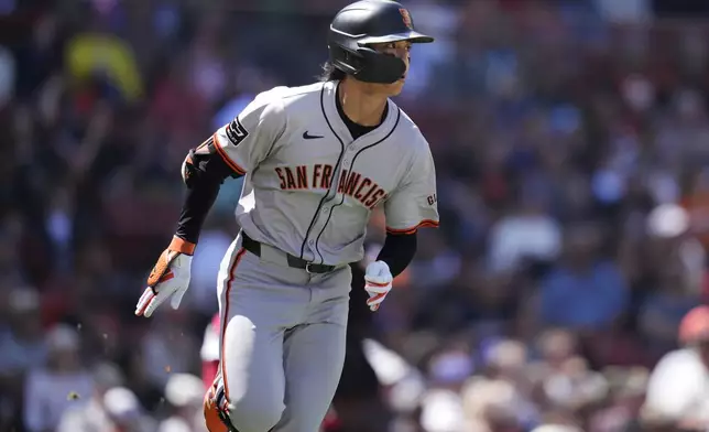 San Francisco Giants' Jung Hoo Lee watches his fly out to center during the third inning of a baseball game against the Boston Red Sox at Fenway Park, Thursday, May 2, 2024, in Boston. (AP Photo/Charles Krupa)
