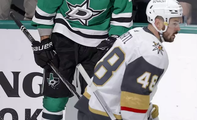 Vegas Golden Knights center Tomas Hertl (48) skates by as Dallas Stars center Wyatt Johnston (53) celebrates his first period goal in Game 7 of an NHL hockey Stanley Cup first-round playoff series, Sunday, May 5, 2024, in Dallas. (AP Photo/Brandon Wade)