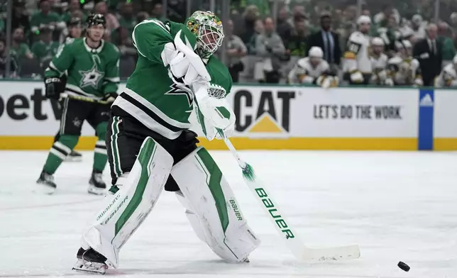 Dallas Stars goaltender Jake Oettinger clears the puck in the second period in Game 5 of an NHL hockey Stanley Cup first-round playoff series against the Vegas Golden Knights in Dallas, Wednesday, May 1, 2024. (AP Photo/Tony Gutierrez)