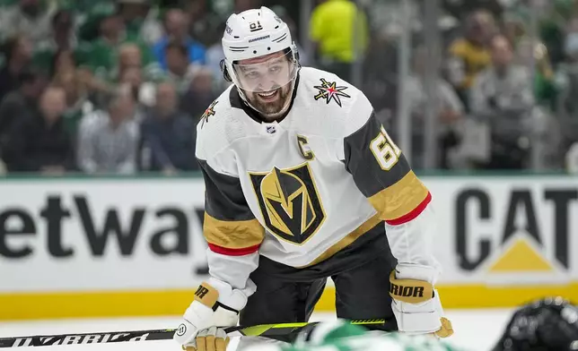 Vegas Golden Knights right wing Mark Stone looks on during the second period in Game 2 of an NHL hockey Stanley Cup first-round playoff series against the Dallas Stars in Dallas, Wednesday, April 24, 2024. (AP Photo/Tony Gutierrez)