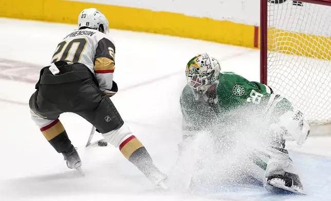 Vegas Golden Knights' Chandler Stephenson prepares to shoot as Dallas Stars goaltender Jake Oettinger (29) defends in the third period in Game 5 of an NHL hockey Stanley Cup first-round playoff series in Dallas, Wednesday, May 1, 2024. (AP Photo/Tony Gutierrez)