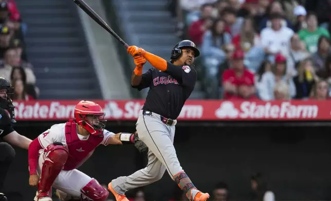 Cleveland Guardians' José Ramírez hits a home run during the third inning of a baseball game against the Los Angeles Angels in Anaheim, Calif., Saturday, May 25, 2024. Tyler Freeman also scored. (AP Photo/Ashley Landis)