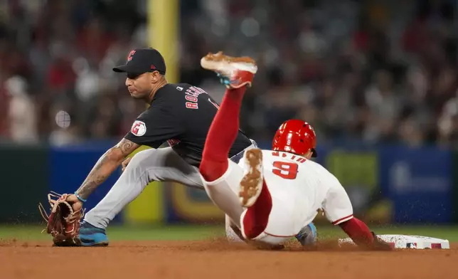 Los Angeles Angels' Zach Neto (9) is caught stealing second by Cleveland Guardians shortstop Brayan Rocchio, left, during the seventh inning of a baseball game in Anaheim, Calif., Saturday, May 25, 2024. (AP Photo/Ashley Landis)