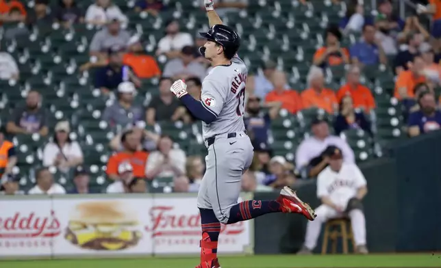 Cleveland Guardians designated hitter Will Brennan celebrates his home run as he rounds the bases against the Houston Astros during the fifth inning of a baseball game Wednesday, May 1, 2024, in Houston. (AP Photo/Michael Wyke)