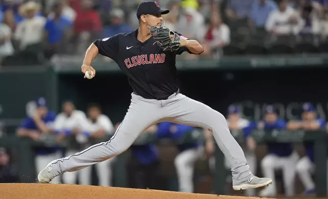 Cleveland Guardians pitcher Carlos Carrasco throws during the first inning of a baseball game against the Texas Rangers in Arlington, Texas, Wednesday, May 15, 2024. (AP Photo/LM Otero)