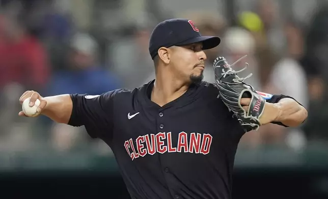 Cleveland Guardians pitcher Carlos Carrasco throws during the first inning of a baseball game against the Texas Rangers in Arlington, Texas, Wednesday, May 15, 2024. (AP Photo/LM Otero)