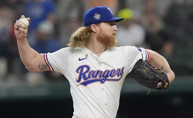 Texas Rangers pitcher Jon Gray throws during the first inning of a baseball game against the Cleveland Guardians in Arlington, Texas, Wednesday, May 15, 2024. (AP Photo/LM Otero)