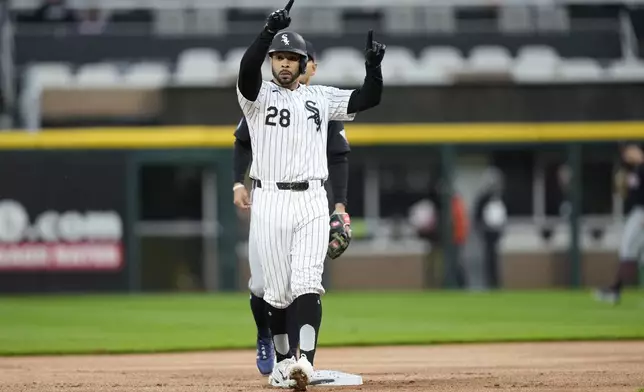 Chicago White Sox's Tommy Pham looks back at the dugout after his leadoff double off Cleveland Guardians starting pitcher Ben Lively during the first inning of a baseball game Thursday, May 9, 2024, in Chicago. (AP Photo/Charles Rex Arbogast)