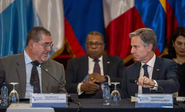 Guatemalan President Bernardo Arevalo, left, and U.S. Secretary of State Antony Blinken attend a regional meeting on irregular migration at the National Palace in Guatemala City, Tuesday, May 7, 2024. Blinken is in Guatemala for a two-day visit. (AP Photo/Moises Castillo)