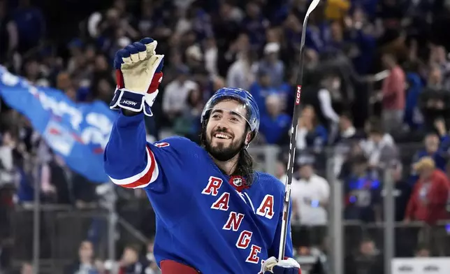 New York Rangers center Mika Zibanejad (93) waves to fans following Game 2 of an NHL hockey Stanley Cup second-round playoff series against the Carolina Hurricanes, Tuesday, May 7, 2024, in New York. The Rangers won 4-3. (AP Photo/Julia Nikhinson)