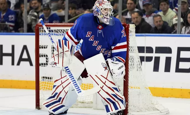 New York Rangers goaltender Igor Shesterkin watches the puck during the second period against the Carolina Hurricanes in Game 1 of an NHL hockey Stanley Cup second-round playoff series, Sunday, May 5, 2024, in New York. (AP Photo/Julia Nikhinson)