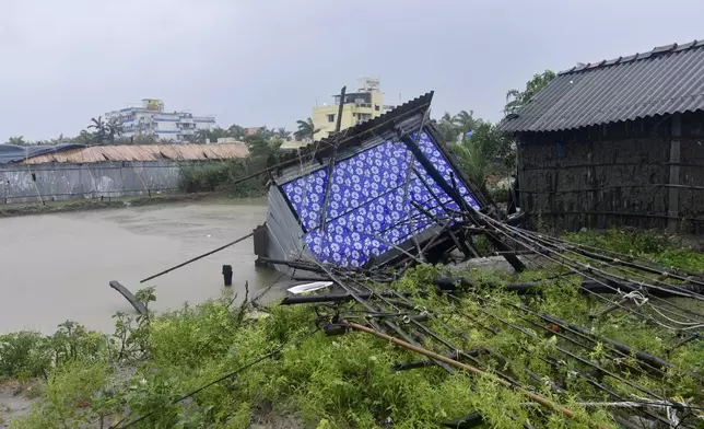 A damaged structure is seen during heavy rains caused by Cyclone Remal along the coastal areas at Bakkhali, South 24 parganas, West Bengal, India, Monday, May 27, 2024. (AP Photo/Ashim Paul)