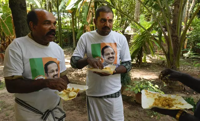 Supporters of M. Abdul Salam, the only Muslim candidate from India's ruling Bharatiya Janata Party, eat breakfast before resuming campaigning in Malappuram, in Indian southern state of Kerala, on April 24, 2024. (AP Photo/Manish Swarup)