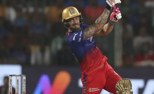 Royal Challengers Bengaluru's captain Faf du Plessis hist a six during the Indian Premier League cricket match between Royal Challengers Bengaluru and Gujarat Titans in Bengaluru, India, Saturday, May 4, 2024. (AP Photo)