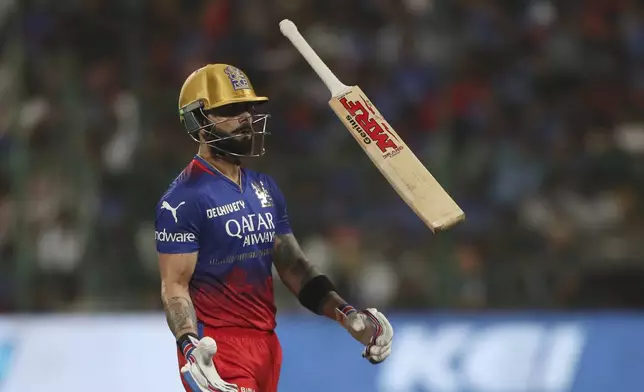 Royal Challengers Bengaluru's Virat Kohli walks off the field after losing his wicket during the Indian Premier League cricket match between Royal Challengers Bengaluru and Gujarat Titans in Bengaluru, India, Saturday, May 4, 2024. (AP Photo)