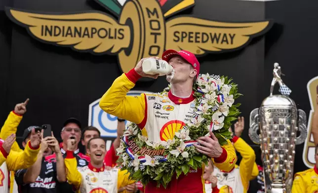 Josef Newgarden celebrates after winning the Indianapolis 500 auto race at Indianapolis Motor Speedway in Indianapolis, Sunday, May 26, 2024. (AP Photo/Michael Conroy)