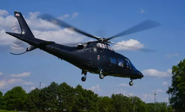 Kyle Larson leaves on a helicopter heading to the NASCAR All-Star race after qualifying for the Indianapolis 500 auto race at Indianapolis Motor Speedway in Indianapolis, Sunday, May 19, 2024. (AP Photo/Michael Conroy)