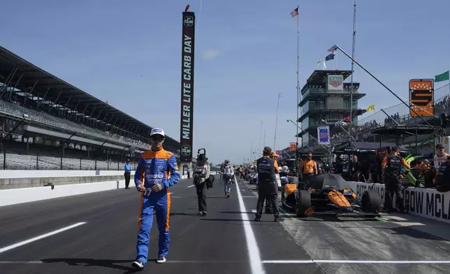 Kyle Larson walks down pit lane before a practice session for the Indianapolis 500 auto race at Indianapolis Motor Speedway, Friday, May 24, 2024, in Indianapolis. (AP Photo/Darron Cummings)