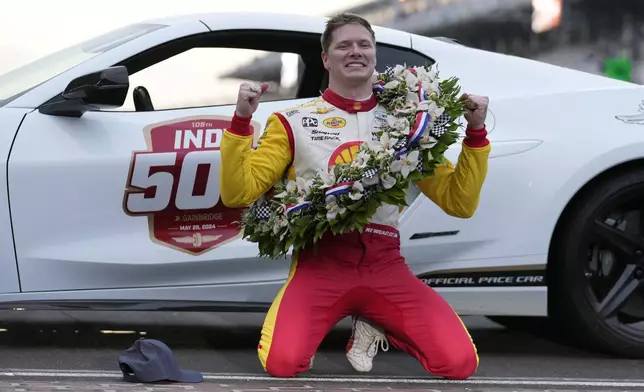 Josef Newgarden celebrates after winning the Indianapolis 500 auto race at Indianapolis Motor Speedway, Sunday, May 26, 2024, in Indianapolis. (AP Photo/Darron Cummings)