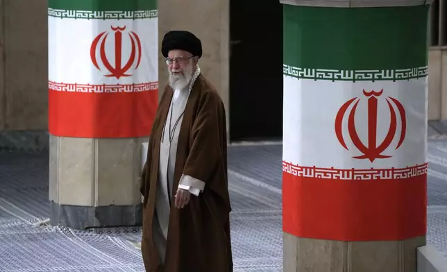 Iranian Supreme Leader Ayatollah Ali Khamenei arrives to vote for the parliamentary runoff elections, in Tehran, Iran, Friday, May 10, 2024. (AP Photo/Vahid Salemi)
