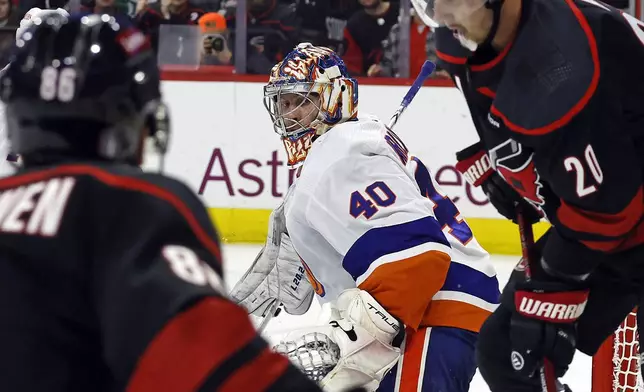 New York Islanders goaltender Semyon Varlamov (40) watches the puck controlled by Carolina Hurricanes' Sebastian Aho (20) during the second period in Game 5 of an NHL hockey Stanley Cup first-round playoff series in Raleigh, N.C., Tuesday, April 30, 2024. (AP Photo/Karl B DeBlaker)