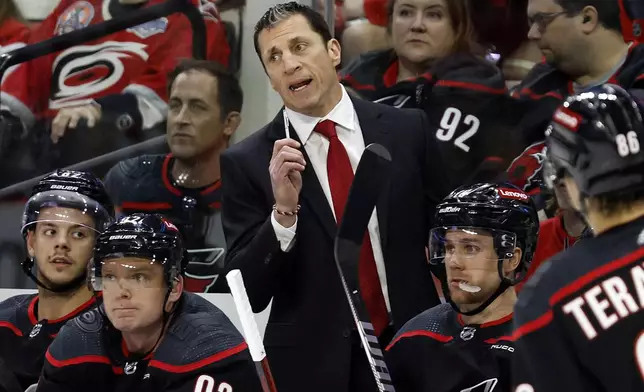 Carolina Hurricanes head coach Rod Brind'Amour talks with an official during the first period in Game 5 of an NHL hockey Stanley Cup first-round playoff series against the New York Islanders in Raleigh, N.C., Tuesday, April 30, 2024. (AP Photo/Karl B DeBlaker)