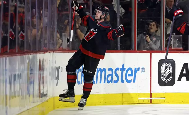 Carolina Hurricanes' Jack Drury (18) celebrates his game winning goal against the New York Islanders during the third period in Game 5 of an NHL hockey Stanley Cup first-round playoff series in Raleigh, N.C., Tuesday, April 30, 2024. (AP Photo/Karl B DeBlaker)