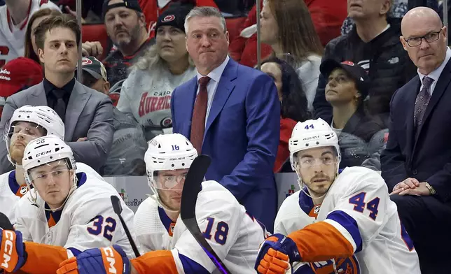 New York Islanders head coach Patrick Roy watches from the bench during the third period in Game 5 of an NHL hockey Stanley Cup first-round playoff series against the Carolina Hurricanes in Raleigh, N.C., Tuesday, April 30, 2024. (AP Photo/Karl B DeBlaker)