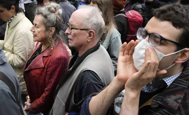 Bernardine Dohrn, left, and Bill Ayers, center, founders of the Weather Underground, participate in a pro-Palestinian protest at the University of Chicago Tuesday, May 7, 2024, in Chicago. (AP Photo/Charles Rex Arbogast)
