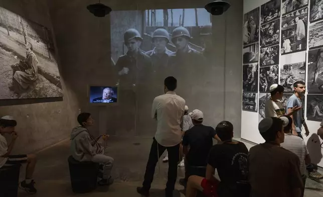 People visit the Yad Vashem Holocaust Memorial Museum in Jerusalem, Sunday, May 5, 2024. The annual Israeli memorial day for the 6 million Jews killed in the Holocaust of World War II begins at sundown Sunday. (AP Photo/Ohad Zwigenberg)