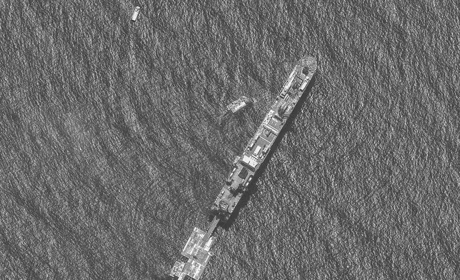 This image provided by Maxar Technologies, shows an April 29, 2024, aerial view of USNS Roy P. Benavidez and floating dock sections during construction of the U.S. military's floating dock that is being assembled offshore of Gaza. The dock and floating pier will be part of the Joint Logistics Over the Shore (JLOTS) system that will help deliver humanitarian aid to Gaza,. (Satellite image ©2024 Maxar Technologies via AP)