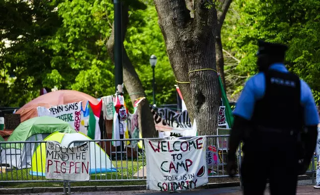 An officer stands outside a Gaza Solidarity Encampment at the University of Pennsylvania in Philadelphia, Wednesday, May 1, 2024. (AP Photo/Matt Rourke)