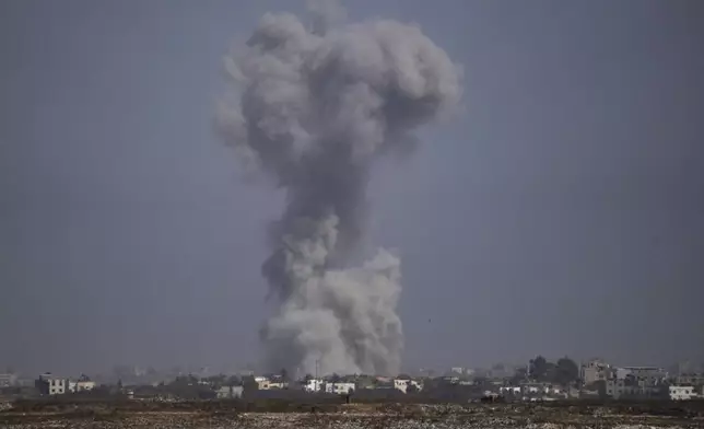 Smoke rises following an Israeli airstrike in the Gaza Strip, as seen from southern Israel Tuesday, May 21, 2024. (AP Photo/Leo Correa)